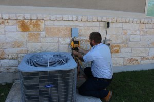 IMG_0059 Strategic Air HVAC technician fixing AC unit.